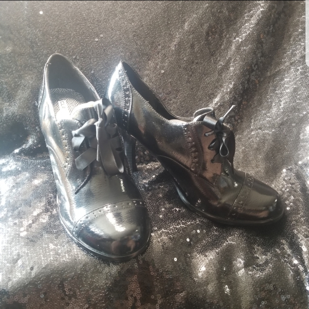 Classified Black patent lace-up oxford. 3⅝ inch heel.
